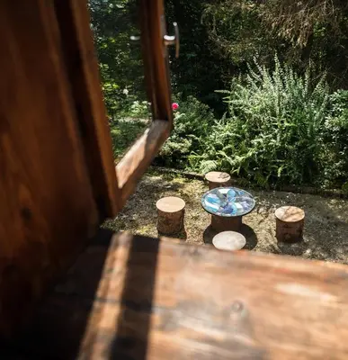 a kitchen counter with a tea kettle and two cups at Ayur Garden Peaceful Forest Retreat in Lanckorona in Lanckorona