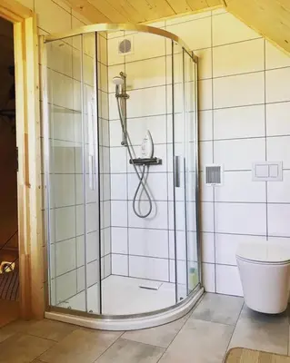 a glass shower in a bathroom with a toilet at Chatka_Kasina in Kasina Wielka