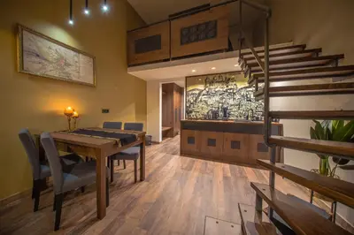 a living room with a couch and a table at Ars Cracovia Apartments in Kraków
