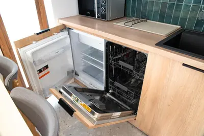 an open refrigerator with its door open in a kitchen at Riviera Camp in Radłów