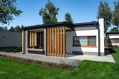a rendering of a small house with wooden poles at Riviera Camp in Radłów