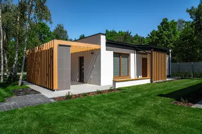 a modern house with a green yard at Riviera Camp in Radłów