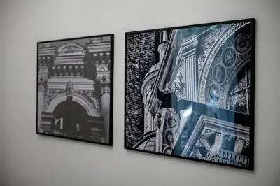 three framed photographs hanging on a wall at Native Apartments Paulińska 20 Deluxe in Kraków