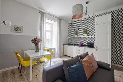 a living room with a couch and a table at Urban Nest Apartments Blich 8 in Kraków