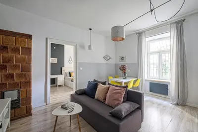 a living room with a couch and a table at Urban Nest Apartments Blich 8 in Kraków