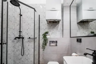 a bathroom with a shower and a sink at Dajwor Residence Jewish Quarter WAWELOFTS in Kraków