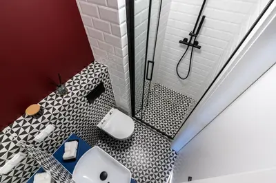 a bathroom with a shower and a white toilet at Smart Apartments - Old Town & Main Train Station - by Upstairs in Kraków