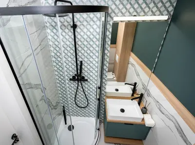 a bathroom with two sinks and a shower at Smart Apartments - Old Town & Main Train Station - by Upstairs in Kraków