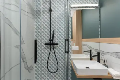 a bathroom with a shower and a sink at Smart Apartments - Old Town & Main Train Station - by Upstairs in Kraków