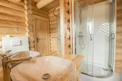 a bathroom with a sink and a shower at Pyrgielówka- chata Roztoki in Stryszawa