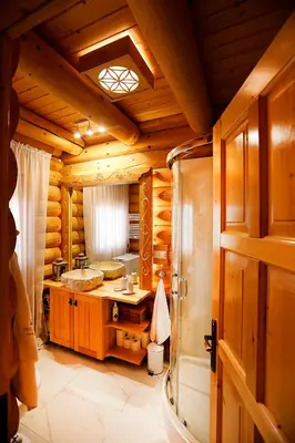 a bathroom in a log cabin with a shower at Pyrgielówka- chata Roztoki in Stryszawa