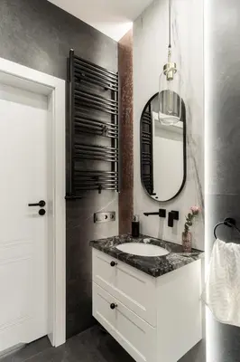a bathroom with a white sink and a mirror at Lovely flat Fabryczna Street AC free parking in Kraków