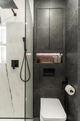 a bathroom with a glass shower with a toilet at Lovely flat Fabryczna Street AC free parking in Kraków