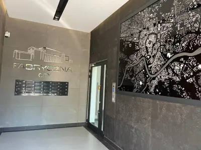 a hallway with a large painting on a wall at Lovely flat Fabryczna Street AC free parking in Kraków