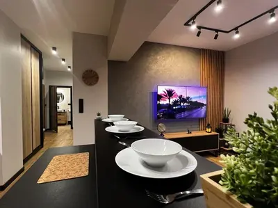 a group of bowls on a counter in a room at Apartament Helsinki in Zator