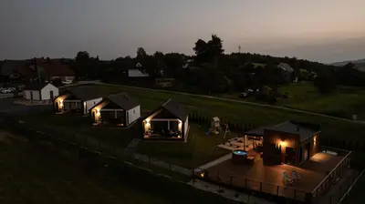an overhead view of a group of tiny houses with lights at Tulichatki domki całoroczne in Tarnawa Dolna