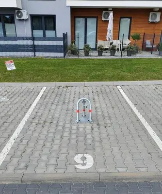 a parking lot with a obstacle in the street at Apartament KoraZone 2 ZATOR in Zator