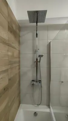 a bathroom with a shower and a bath tub at Apartament KoraZone 2 ZATOR in Zator