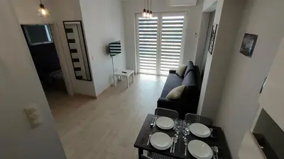 a living room with a couch and a table at Apartament KoraZone 2 ZATOR in Zator