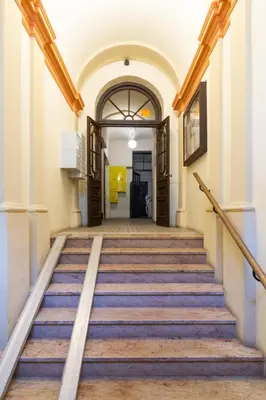 an empty hallway with stairs in a building at Lilly apartment main train station old town by The Heritage House Main Square Cracow in Kraków
