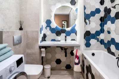 a bathroom with a toilet and a sink and a mirror at Republiki in Kraków
