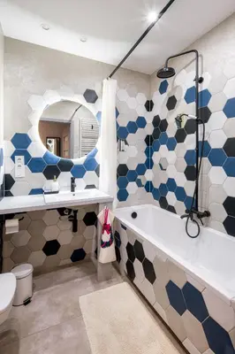 a bathroom with a tub and a toilet and a sink at Republiki in Kraków