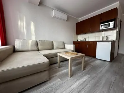 a living room with a couch and a table at Kompleks Apartament-Serwis in Kraków