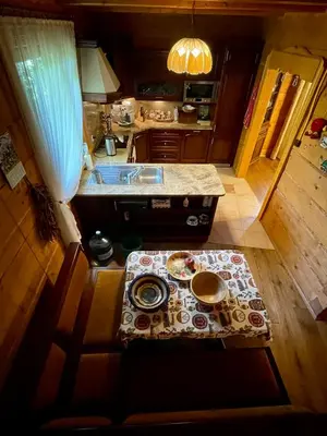an aerial view of a kitchen with a table at Dom z bali przy szlaku in Kasina Wielka