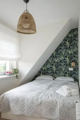 a bedroom with a bed with a green wall at Złota#208 in Złota