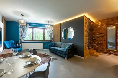 a living room with a table and a couch at Premium Apartment for Jewish Quarter & Old Town plus Pool in Kraków
