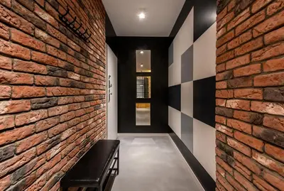 a hallway with a brick wall and a bench at Premium Apartment for Jewish Quarter & Old Town plus Pool in Kraków