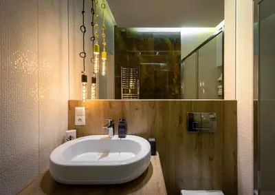 a bathroom with a white sink and a mirror at Premium Apartment for Jewish Quarter & Old Town plus Pool in Kraków