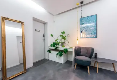 a mirror in a room with a chair and a table at Premium Apartment for Jewish Quarter & Old Town plus Pool in Kraków