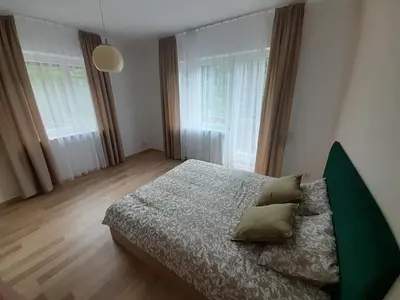 a bedroom with a bed with two pillows on it at Apartament Koninki in Koninki