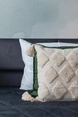 a close up of a pillow on a bed at Deluxe Studio Cracow Ariańska by Noclegi Renters in Kraków