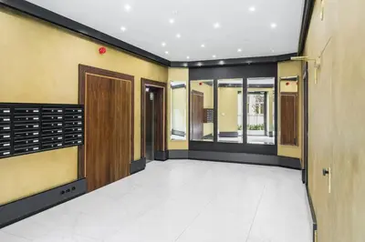 a hallway of a building with doors and windows at Rakowicka Apartments with tarrace, AC and free parking in Kraków