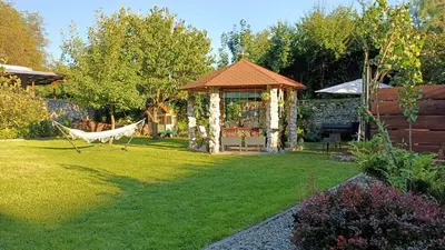 a gazebo with a hammock in a yard at Apartament u Agaty Czernichów Kraków Zator in Czernichów
