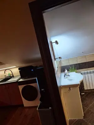 a small kitchen with a sink and a counter at Apartament u Agaty Czernichów Kraków Zator in Czernichów