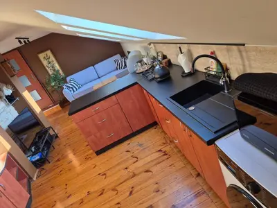 an overhead view of a kitchen with a sink and a couch at Apartament u Agaty Czernichów Kraków Zator in Czernichów