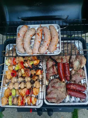 a tray of food with sausages and other foods at Domki Na Grapie - z widokiem na Tatry in PyzÃ³wka