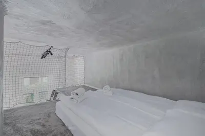 a bedroom with a white bed with towels on it at Parkside Fresh Apartments - Old Town Guesthouse - by Upstairs in Kraków
