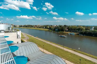 a view of a river with a boat in it at Blue Swan in Kraków