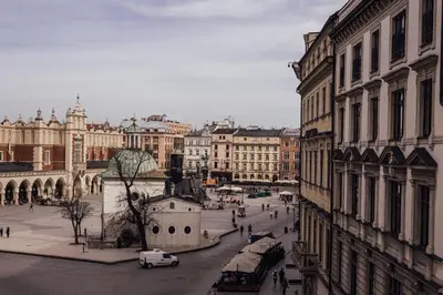 a view of a city street with buildings and cars at Hotel Rezydent in Kraków