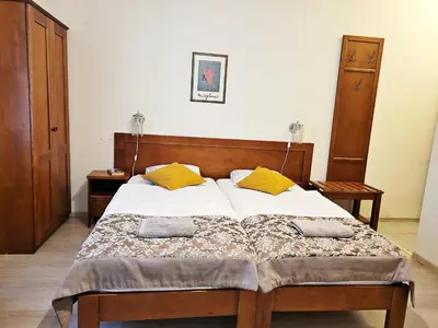 a bedroom with a bed with two pillows on it at DReAM Post Aparthotel in Kraków