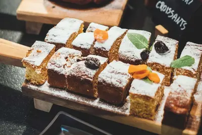 a cake on a table with snow on it at Vienna House Easy by Wyndham Cracow in Kraków