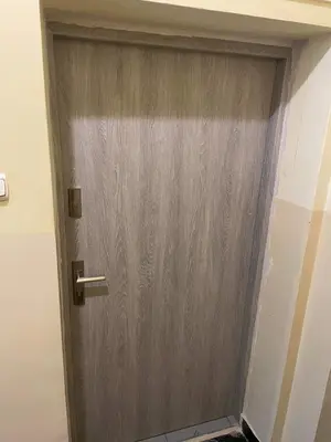 a door to a building with graffiti on it at Daszyńskiego 7m3 in Kraków