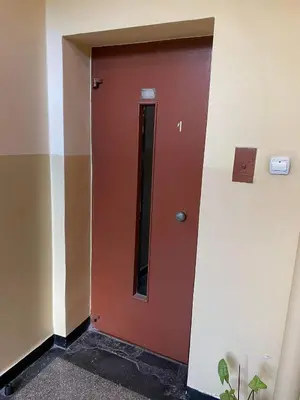 a wooden door in a room with at Daszyńskiego 7m3 in Kraków