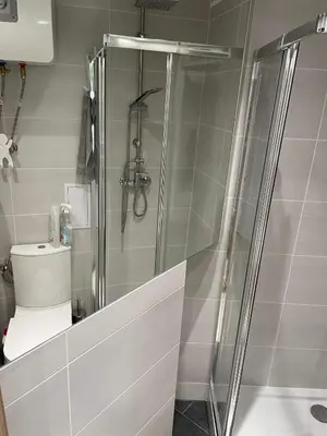 a shower stall in a bathroom with a toilet at Daszyńskiego 7m3 in Kraków