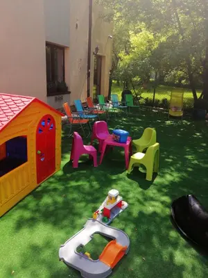 a group of childrens play equipment in a yard at Hotel Petrus in Kraków