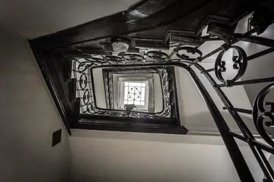 a mirror on a wall in a room at Hotel Elektor Premium in Kraków